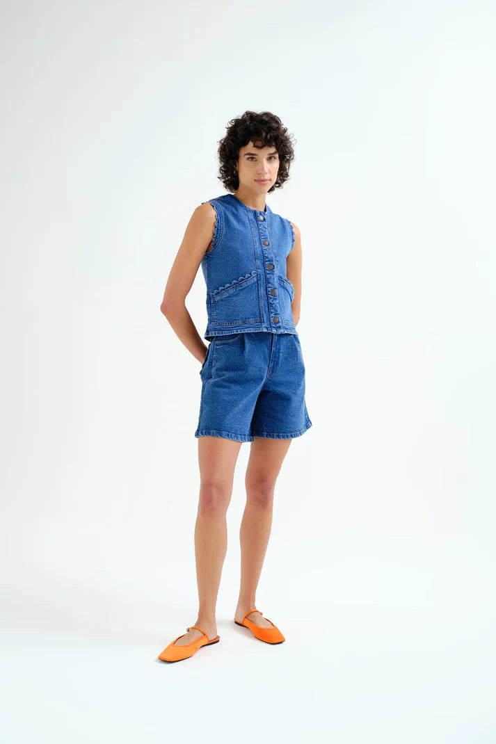 Blue denim vest with wavy detail