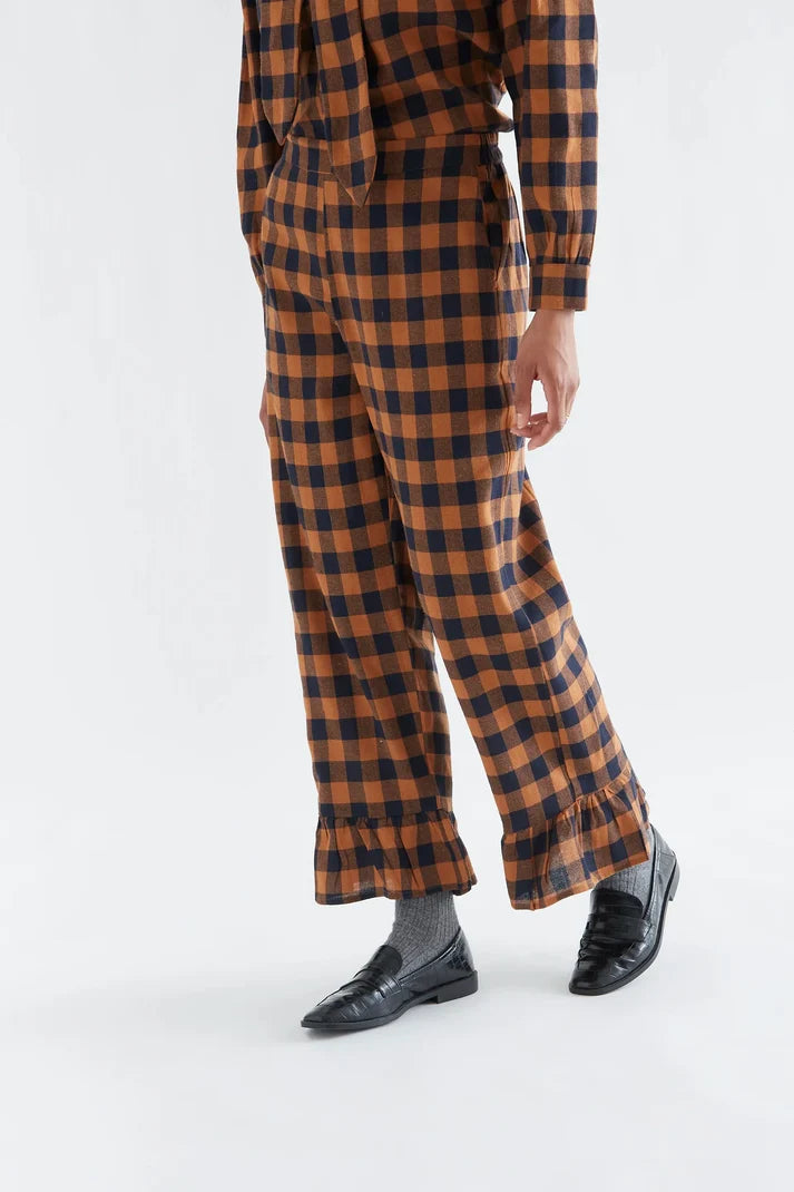 100% cotton pants with a brown and navy plaid pattern