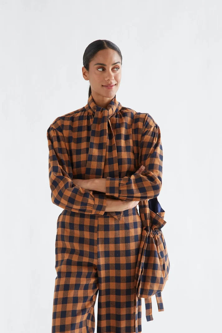 100% cotton pants with a brown and navy plaid pattern